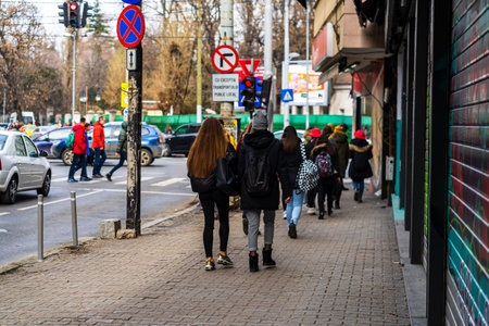 People moving, pedestrians walking in downtown district of Bucharest, Romania, 2021のeditorial素材