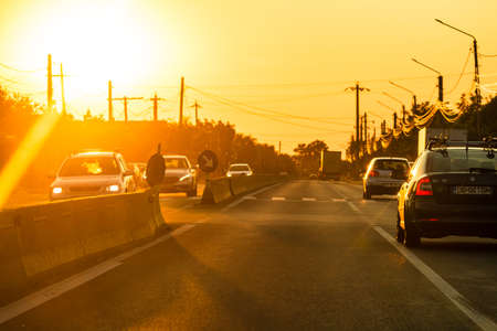 Car traffic at rush hour. Traffic jam, cars on the road at sunset in Bucharest, Romania, 2021のeditorial素材