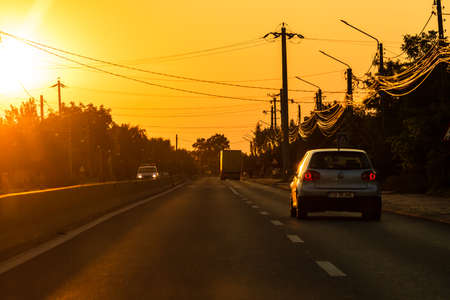 Car traffic at rush hour. Traffic jam, cars on the road at sunset in Bucharest, Romania, 2021のeditorial素材