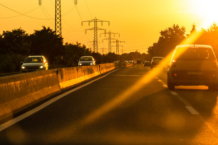 Car traffic at rush hour. Traffic jam, cars on the road at sunset in Bucharest, Romania, 2021