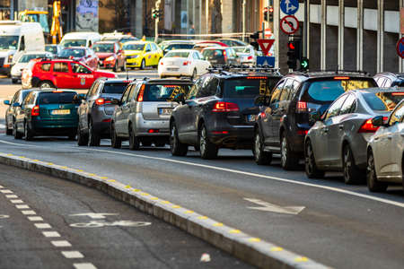 Car traffic at rush hour in downtown area of the city. Car pollution, traffic jam in the morning and evening in the capital city of Bucharest, Romania, 2021のeditorial素材