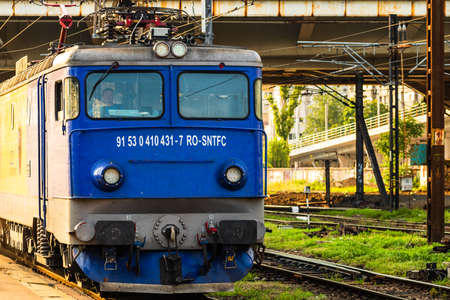 Train waiting at train platform at Bucharest North Railway Station (Gara de Nord Bucharest). Commuting by train in Europe, Romania, Bucharest 2021のeditorial素材