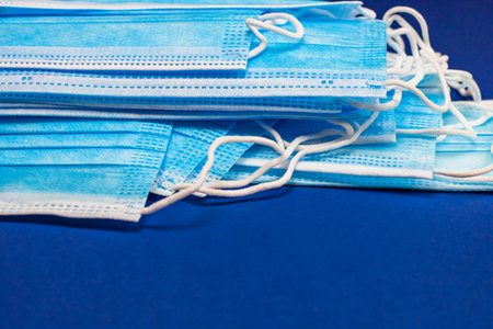 Close up and detail of medical hygienic mask, face protective surgical masks isolated.