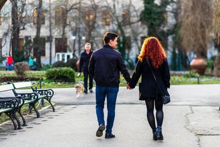 People moving, walking on the streets in downtown of Bucharest, Romania, 2021