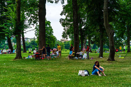 People having picnic relaxing and having fun during coronavirus crisis in park and gardens of the domain from Mogosoaia in Bucharest, Romania, 2020.のeditorial素材