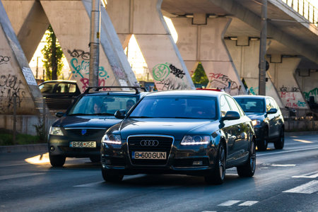 Car traffic at rush hour. Traffic jam, cars on the road at sunset in Bucharest, Romania, 2021