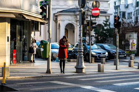 People moving, pedestrians walking in downtown district of Bucharest, Romania, 2021