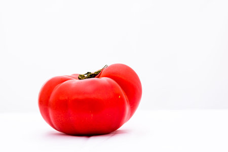 Fresh and tasty ripe red tomatoes isolatedの写真素材