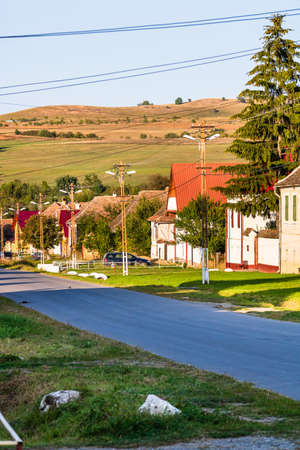 View of picturesque village Viscri in Romania. Painted traditional old houses in medieval Saxon village of Viscri, Romania, 2021の写真素材