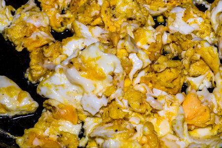 Scrambled eggs. Cooking ingredients from a farmers markets for breakfast