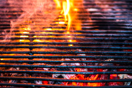 Empty hot charcoal barbecue grill with bright flame
