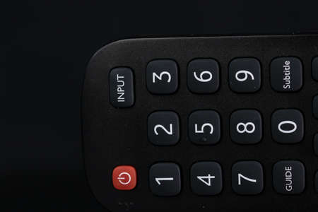 Selective focus, details of TV remote control buttons. Bucharest, Romania, 2021.の写真素材