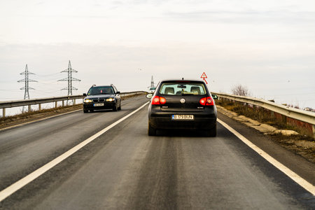 Road view through car windshield, cars on road in traffic in Bucharest, Romania, 2021のeditorial素材