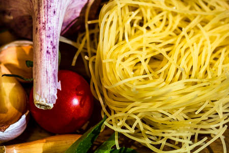 Italian food ingredients on wooden table. Cooking conceptの写真素材