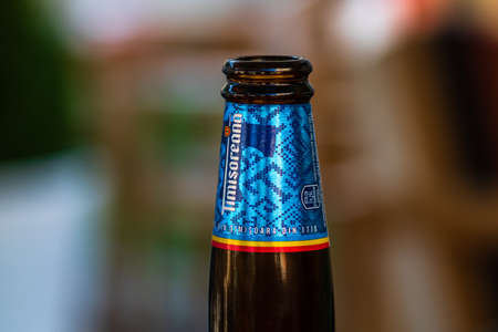 Romanian Timisoreana beer isolated, close up on detail of glass beer bottle. Bucharest, Romania, 2020のeditorial素材