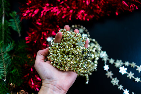 Woman holding in her hands a Christmas decorative ornamentの写真素材