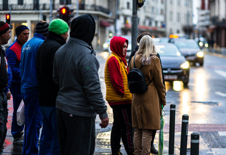 People walking or crossing the street in downtown Bucharest, Romania, 2021