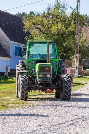 Agricultural tractor on road in Viscri, Romania, 2021のeditorial素材
