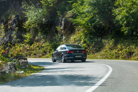Traveling car in motion on asphalt mountain road in Bihor, Romania, 2021のeditorial素材