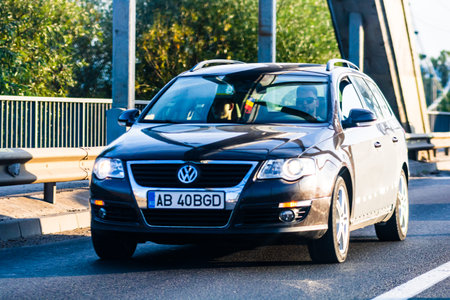 Traveling cars in motion on asphalt road, front view of cars in row on street. Bucharest, Romania,...
