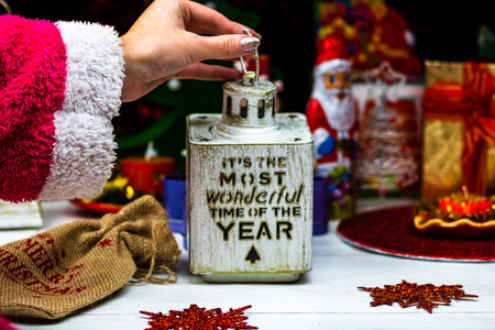 Woman holding in her hands a Christmas decorative ornament