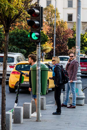 People moving, pedestrians walking in downtown district of Bucharest, Romania, 2021のeditorial素材