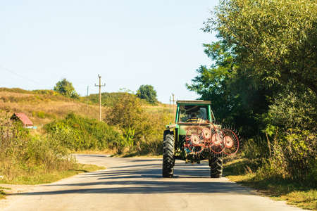 Agricultural tractor on road in Viscri, Romania, 2021のeditorial素材