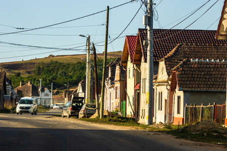 View of picturesque village Viscri in Romania. Painted traditional old houses in medieval Saxon village of Viscri, Romania, 2021のeditorial素材
