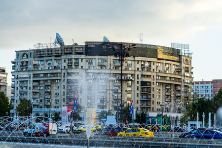 Fountain at Unirii Square in downtown of Bucharest.  Unirii Boulevard in Bucharest, Romania, 2021