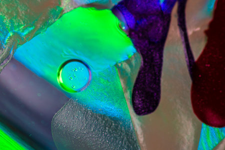 Abstract colorful backdrop with oil drops and waves on water surface. Abstract background concept