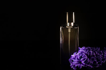 Elegant perfume bottle isolated on black background with copy space.の写真素材