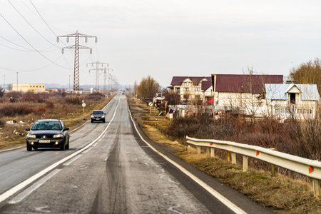 Cars on the road in traffic in Targoviste, Romania, 2021のeditorial素材