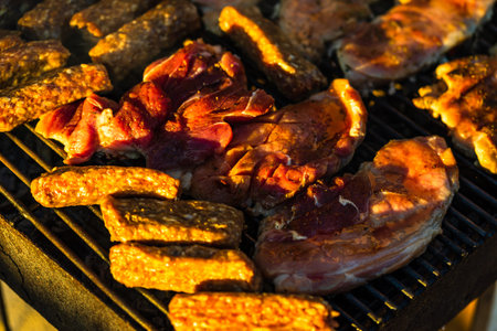 Grilling  pork chops on barbecue grill. BBQ in the garden