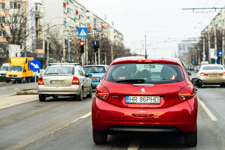 Road view through car windshield, cars on road in traffic in Bucharest, Romania, 2021のeditorial素材
