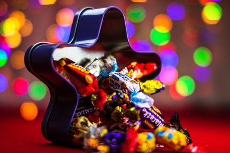 Chocolate candies mix in front of the Christmas tree lights in Bucharest, Romania, 2021のeditorial素材