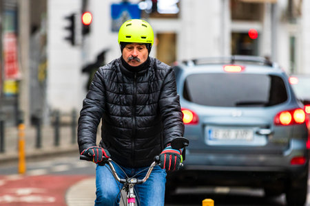 Riding a bike. Commuters on bike in Bucharest, Romania, 2021のeditorial素材