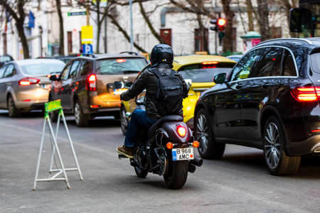 Cars in traffic at rush hour in downtown area of the city. Car pollution, traffic jam in the morning and evening in the capital city of Bucharest, Romania, 2021のeditorial素材
