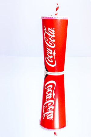 Coca Cola paper cup. Illustrative editorial photo in studio in Bucharest, Romania, 2021