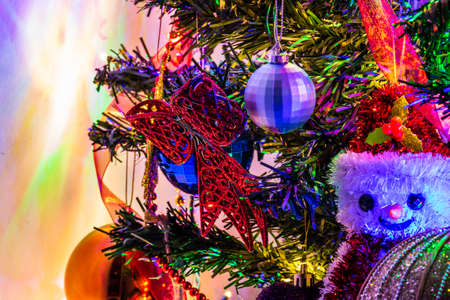 Christmas decoration in Christmas tree with Christmas lightsの写真素材
