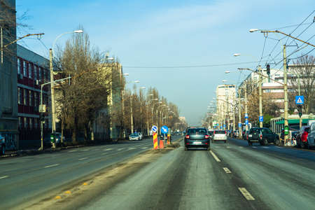 Road view through car windshield, cars on road in traffic in Bucharest, Romania, 2021のeditorial素材