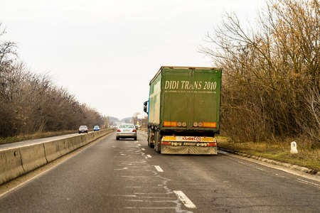 Heavy duty truck in traffic in Bucharest, Romania, 2021のeditorial素材
