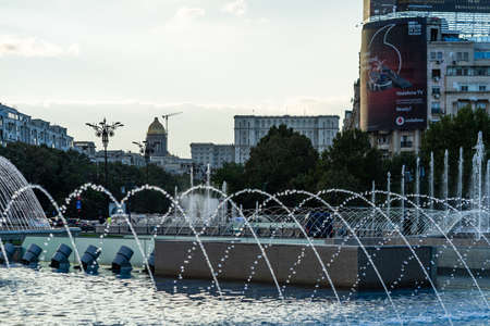 Fountain at Unirii Square in downtown of Bucharest.  Unirii Boulevard in Bucharest, Romania, 2021のeditorial素材