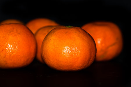 Detail of orange fruit on black backgroundの写真素材