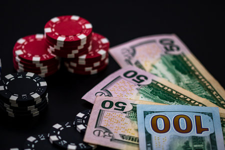 Stacks of poker chips with money and cards