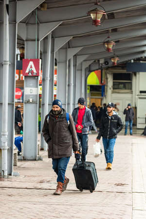 Travelers and commuters waiting for a train on the train platform of Bucharest North Railway Station (Gara de Nord Bucharest) in Bucharest, Romania, 2022のeditorial素材