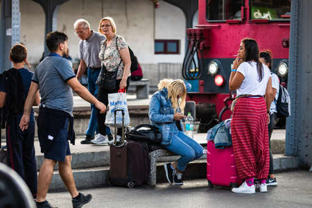 Travelers and commuters waiting for a train on the train platform of Bucharest North Railway Station (Gara de Nord Bucharest) in Bucharest, Romania, 2022のeditorial素材