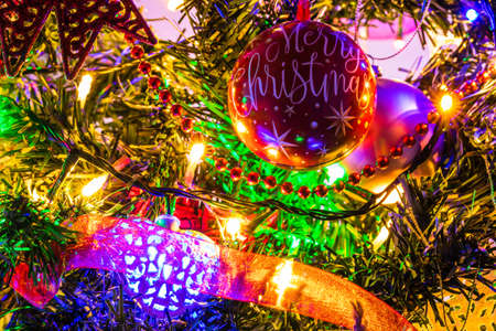 Christmas decoration in Christmas tree with Christmas lightsの写真素材
