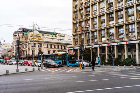 Cars in traffic at rush hour in downtown area of the city. Car pollution, traffic jam in the morning and evening in the capital city of Bucharest, Romania, 2021のeditorial素材