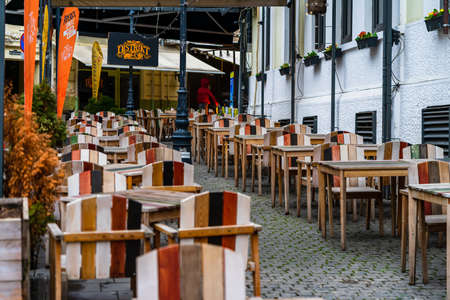 Close up of an empty tables with empty chairs at a local outdoor resturant in Bucharest, Romania, 2021のeditorial素材