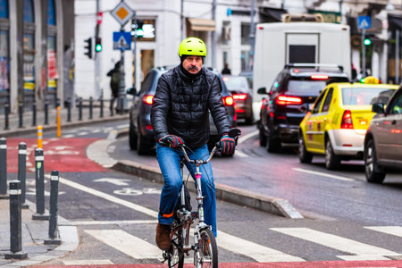 Riding a bike. Commuters on bike in Bucharest, Romania, 2021のeditorial素材
